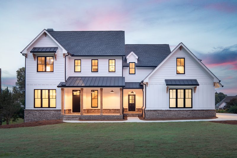 Front elevation at dusk — Shadburn Ferry, a custom home built by Ironwood Construction Group in Buford, Georgia